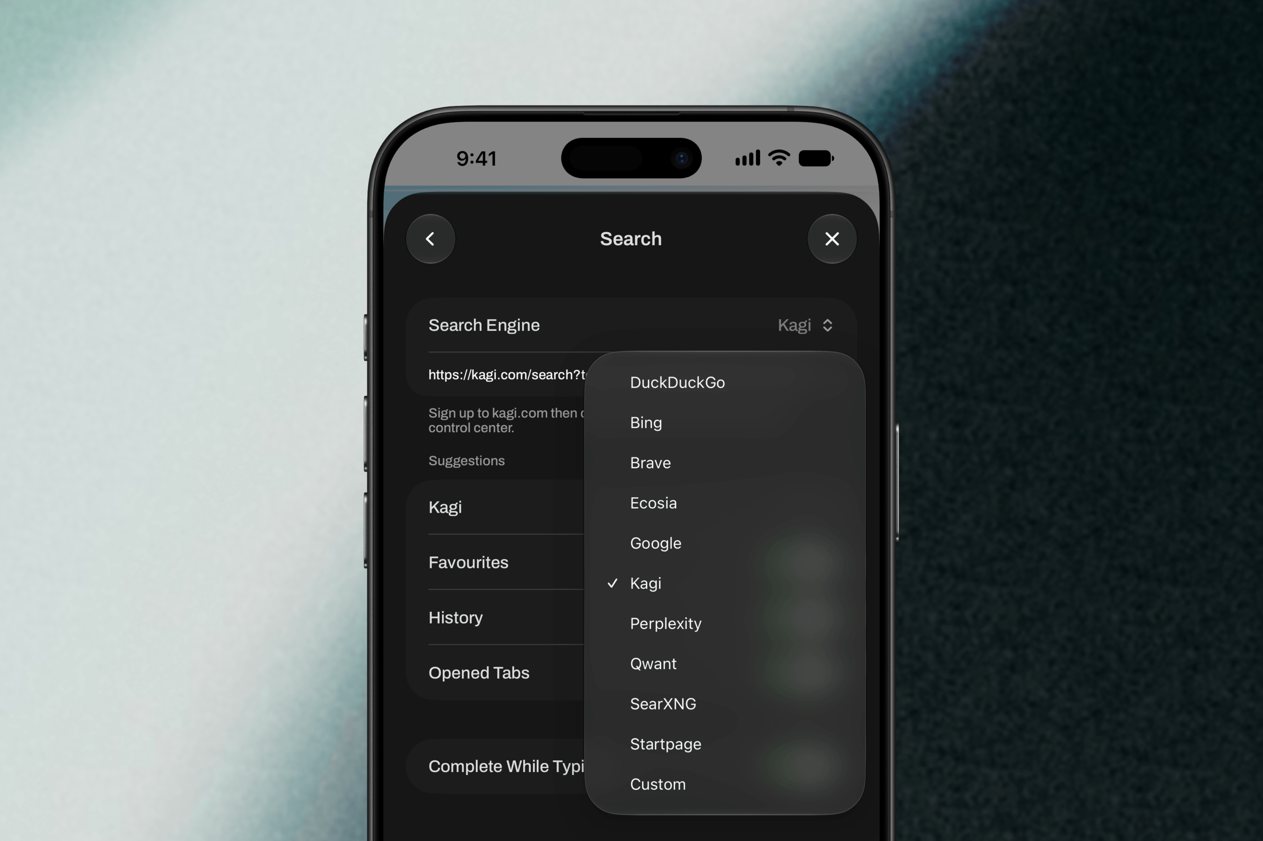 A smartphone screen showing a search settings menu with a dropdown list of search engines, including DuckDuckGo, Bing, Brave, Ecosia, Google, Kagi, Perplexity, Qwant, SearXNG, Startpage, and Custom. The selected search engine is Kagi.