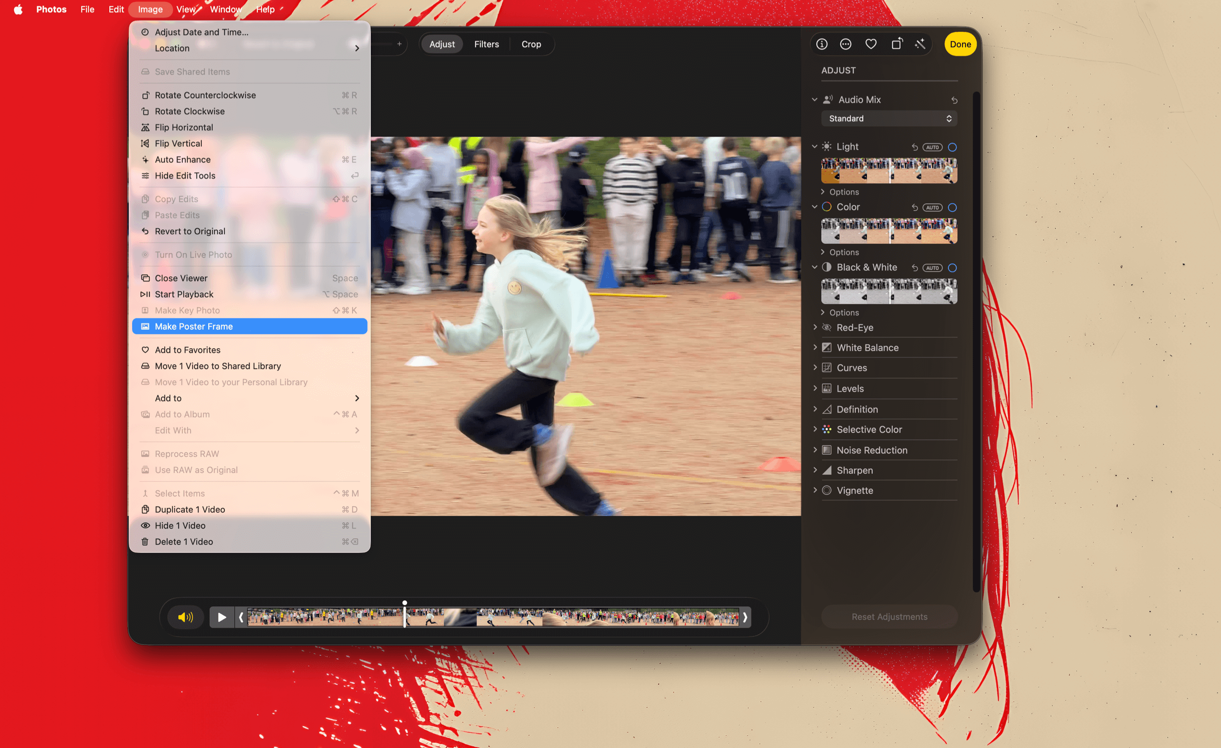 A screen capture of the Photos app on a Mac, showing a video being edited. The main subject is a young girl running in a field. The app's interface includes the menu bar with options like 'Image' and 'Adjust', an adjustment panel with light, color, and black & white options, a video timeline at the bottom, and the 'Make Poster Frame' option selected within the 'Image' menu.

